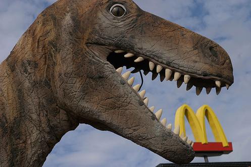 DINOSAUR STATUE OUTSIDE A MCDONALD'S SOMEWHERE IN ARIZONA.