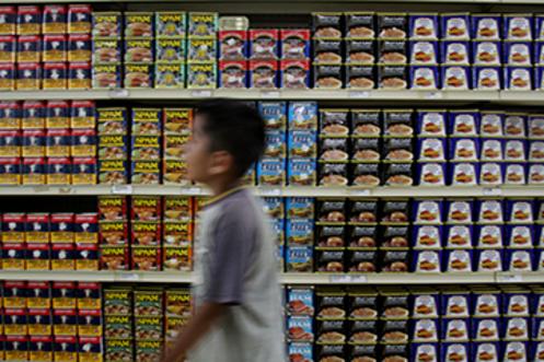 N THE PACIFIC ISLANDS, CANNED MEAT IS PLENTIFUL. HOWEVER, MY GUESS IS THIS YOUNG MAN WAS PASSING THROUGH TO THE CANDY ISLE.